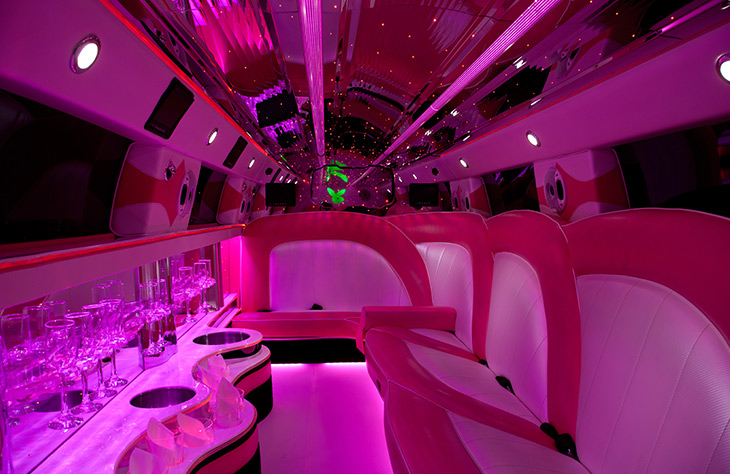 Pink limo bus hire